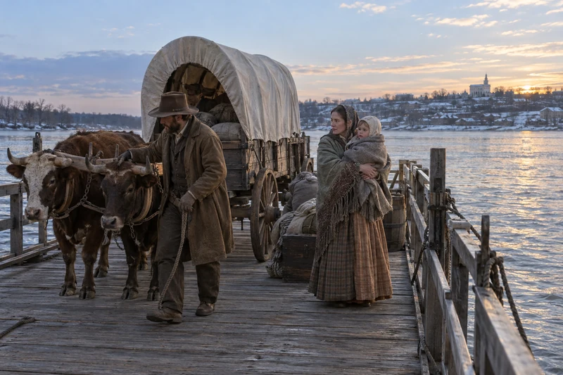 A family and wagon aboard a wooden ferry on the Mississippi near Nauvoo.