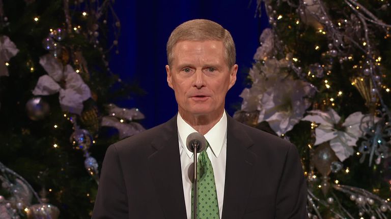David A. Bednar speaking at the Christmas devotional.