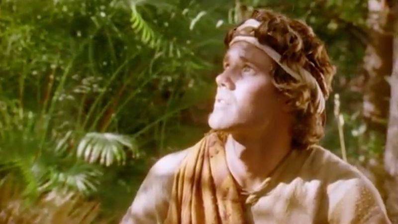 A man looks upward in a Church dramatization of the promised birth sign.